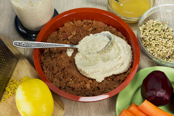 Preparation of raw vegan berry cheesecake gluten-free on a brigh