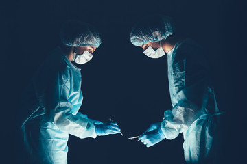 Medical team  hospital performing operation. Group of surgeon at work in operating theatre room. healthcare .