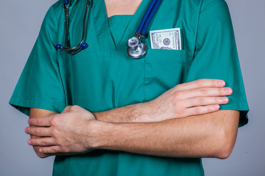 Doctor's Scrub Top With Stethoscope And One Hundred Dollar Bill.