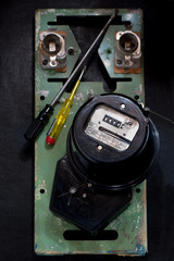 Retro electric meter and  screwdrivers.