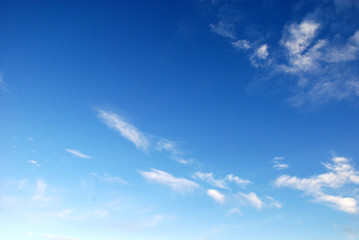 white clouds in the pure blue sky background