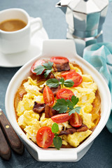 Baked potatoes with cheese sauce and eggs