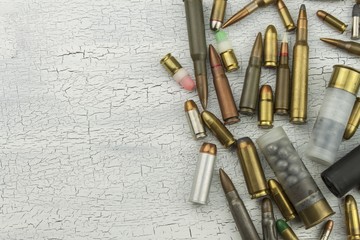 Different types of ammunition. Bullets of different calibers and types. The right to own a gun. Sales of weapons and ammunition.
 - obrazy, fototapety, plakaty