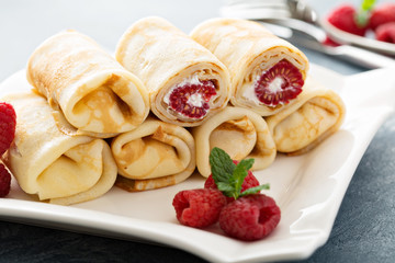 Crepes filled with cottage cheese and raspberry