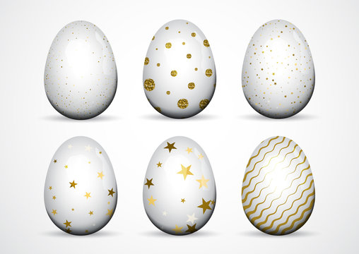 Set of white Easter eggs with golden dots, stripes on white background.
