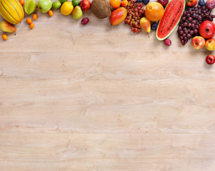 Healthy fruits background / studio photo of different fruits on wooden table
