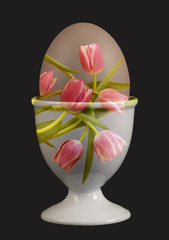 double exposure chicken egg in cup with fresh tulip arrangement - 104319044