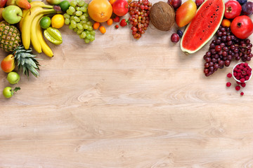 Healthy fruits background / studio photo of different fruits on wooden table