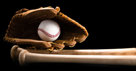 Baseball equipment on black