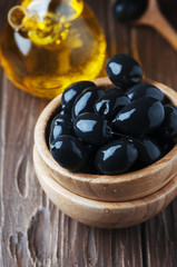 Greek black olive and oil on the wooden table