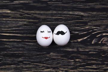 Funny eggs with painted faces