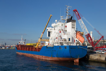 Cargo ship loading in a trading port