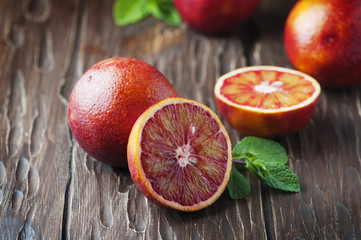 Red sweet bloody oranges on the wooden table