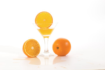 orange slice falls in a glass