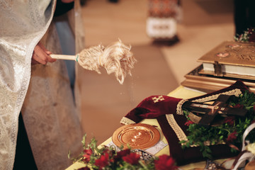 Luxurious rings in the church. Wedding ceremony