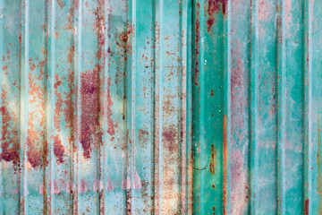 A background of peeling paint and rusty old metal