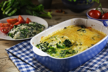 baked spinach with cheese parmesan in the baking dish