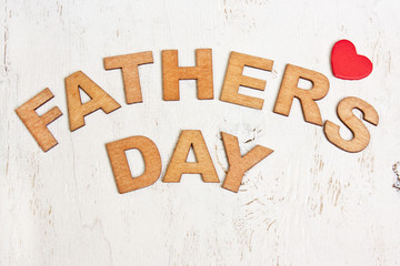 Fathers Day with wooden letters on an old white  background
