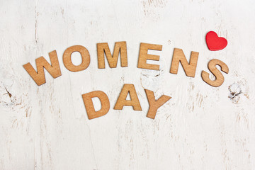  Womens Day with wooden letters on an old white  background