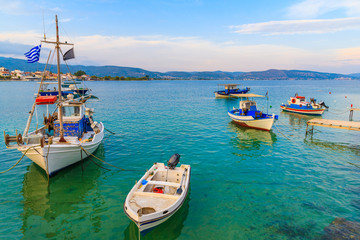 Obraz premium Fishing boats anchoring in bay on coast of Samos island, Greece