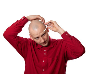 Young man puts on head headset EEG (electroencephalography)