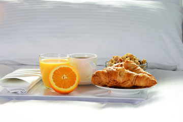 Breakfast in bed in hotel room.