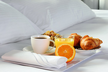 Breakfast in bed in hotel room. - obrazy, fototapety, plakaty
