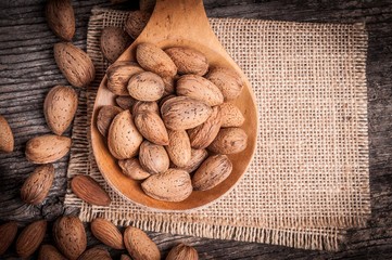 Almond nuts in mixing scoop 