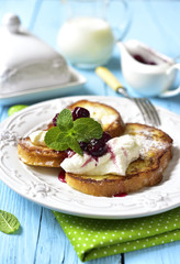 French toasts with ricotta and cherry syrup.