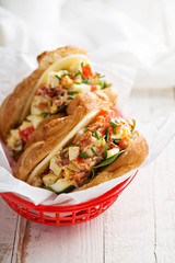 Croissant sandwich with egg salad and spinach