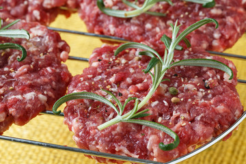 Raw minced hamburger meat with herb and spice prepared for grill