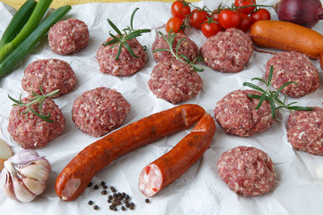 Raw minced hamburger meat and sausage with herb and spice prepar