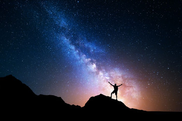 Milky Way. Night sky and silhouette of a standing man © den-belitsky