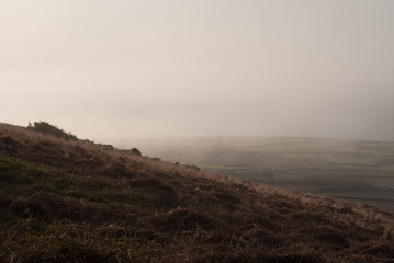 Countryside moorlands in the mist at dusk