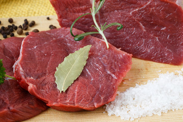 Raw beef meat on a cutting board
