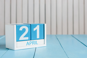 April 21st. Image of april 21 wooden color calendar on white background.  Spring day, empty space for text