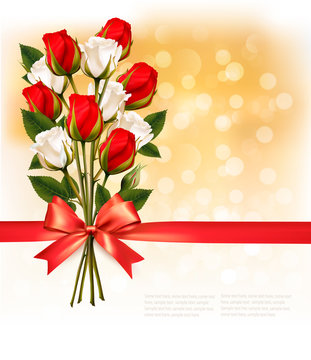 Bouquet of red and white roses with a red ribbon on gold booker