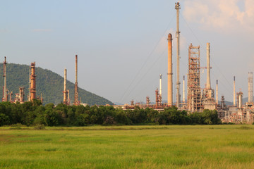 Fototapeta na wymiar Petrochemical factory in green field