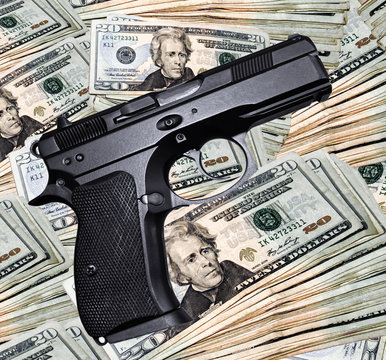 A black handgun and a pile of money.