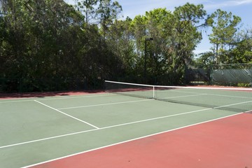 Empty tennis court in living community