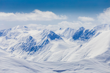 Fototapeta na wymiar Panoramic view at snowy mountains