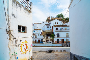 Fototapeta premium Setenil de las Bodegas is a town in the province of Cadiz, Spain, famous for its dwellings built into rock overhangs above the Rio Trejo. Andalusia. Spain