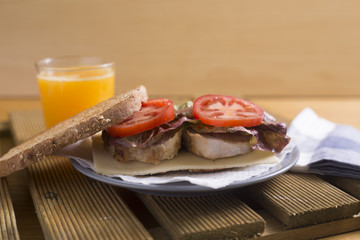steak sandwich and orange juice