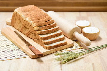 Fototapeta na wymiar sliced bread on wooden table