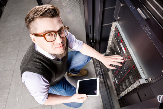 Young engineer in a datacenter