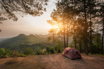 Tents on a hills at sunrise at Taksin Maharach National Park Tak,Thailand. - 104345881