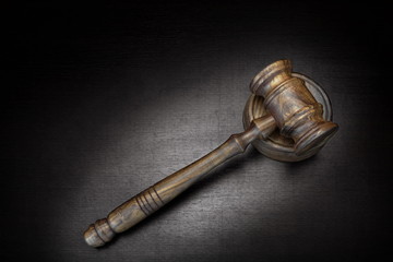 Top View Of Judges Gavel On Grunge Wood Background