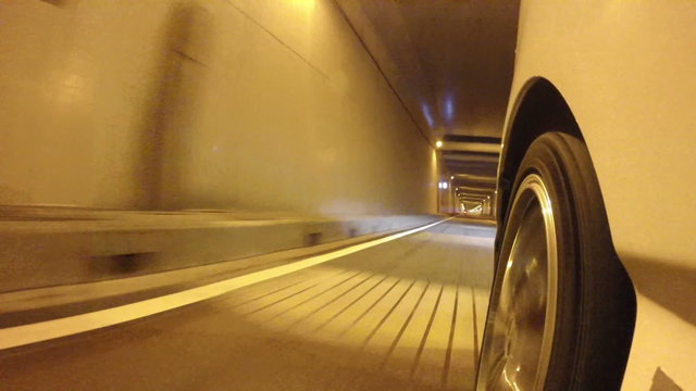 Front wheel variation of a car running through the nightscape of Tokyo and Rainbow Bridge.