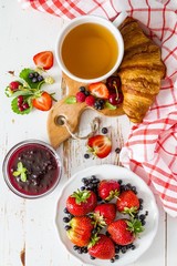 Fototapeta na wymiar Breakfast - croissants with berries