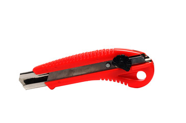 Fototapeta premium Red stationery knife on a white background